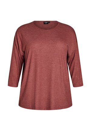 Damska bluzka w kolorze rdzy, z długim rękawem, okrągłym dekoltem i miękką, lekko teksturowaną tkaniną, rozmiar średni.