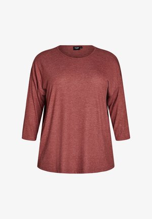 Maglia da donna a maniche lunghe di colore ruggine con collo girocollo e tessuto morbido leggermente strutturato, taglia media.