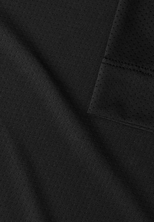 Black textured fabric showing a mesh pattern with a smooth weave, featuring a folded edge and stitched seam details.
