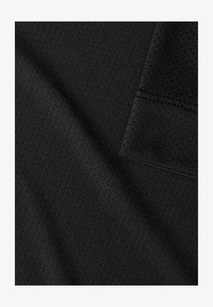 Black textured fabric showing a mesh pattern with a smooth weave, featuring a folded edge and stitched seam details.