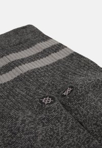 Gray socks with textured knit, featuring a thin striped design in a lighter gray and two embroidered accents near the top.