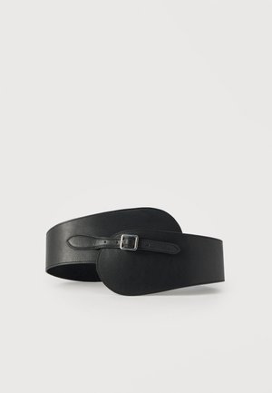 Black leather belt featuring an elongated shape with a rounded end, a sleek buckle, and a smooth texture.