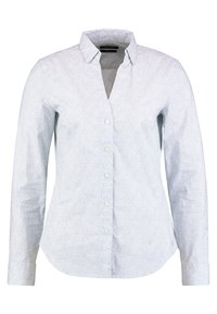 Camicia a maniche lunghe azzurro chiaro con un motivo sottile, design con colletto, chiusura frontale con bottoni e orlo curvo. Tessuto in cotone con una texture liscia.