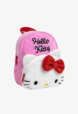 Pink plush Hello Kitty backpack with embroidered logo, white front, red bow, and zippers. Features rounded shape and soft texture.