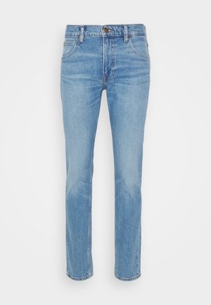 Light blue denim jeans featuring a straight cut, five-pocket design, and a front button closure. Smooth texture with subtle fading detail.