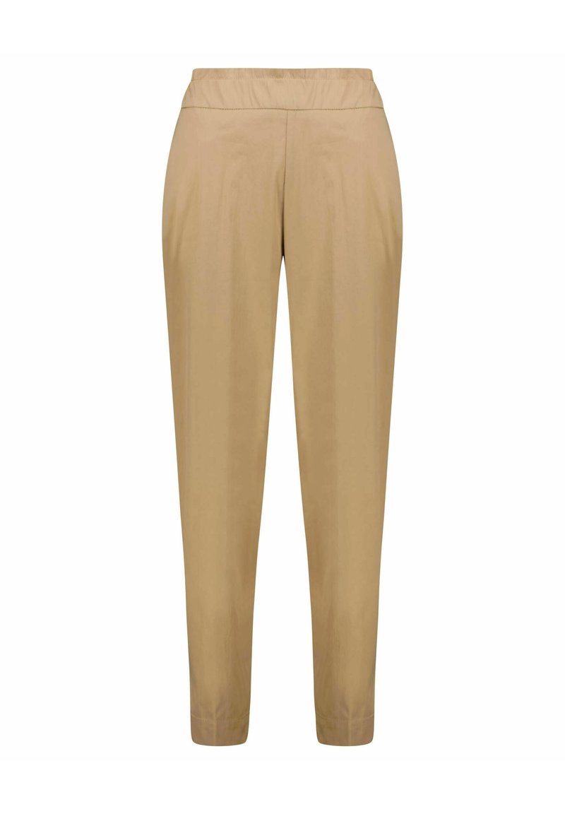 Beige Hosen mit elastischem Bund, schmal zulaufendem Bein, glatter Textur und minimalen Nähten, geeignet für die Freizeit.
