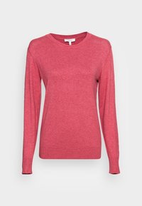 Pull à manches longues avec col rond, de couleur rose uni, avec poignets et ourlet côtelés, présenté sur un fond neutre.