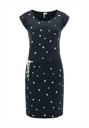 Mørkeblå kjole med hvide hjerteprint, korte ærmer, rund halsudskæring og en hvid snøre i taljen.