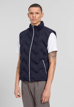 Marineblaues Steppweste mit hohem Kragen, durchgehendem Reißverschluss und zwei seitlichen Taschen. Bietet eine gesteppten Textur und ein elegantes Design.