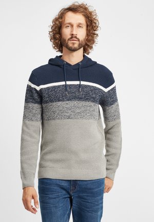 Sudadera con capucha que presenta bloques de color en azul marino y gris, patrón de punto texturizado y una franja de acento blanca. Terminada con cordones ajustables.