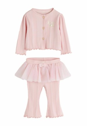Light pink ribbed baby outfit with long-sleeve top featuring heart buttons and gold deer, paired with ruffled skirted pants with a bow.
