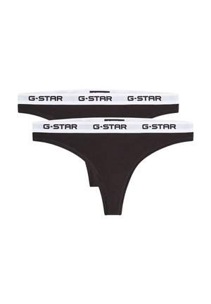 Two black thong-style underwear with white elastic waistbands featuring the black "G-STAR" logo repeated around the band.