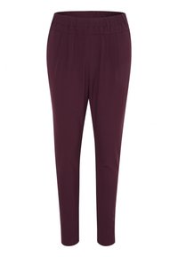 Pantalon bordeaux à coupe fuselée avec une ceinture plate et des plis devant, fabriqué en tissu doux, présentant une texture lisse et sans éléments métalliques visibles.