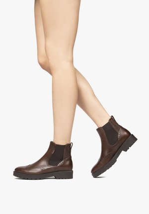 Brown leather ankle boots with elastic side panels, flat soles, and decorative stitching along the edges. Smooth texture and practical design.