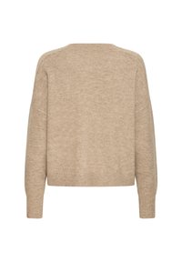 Beżowy sweter dziewiarski o luźnym kroju, z obniżonymi ramionami i ściągaczami. Miękka faktura, średnia grubość i minimalne detale na plecach.