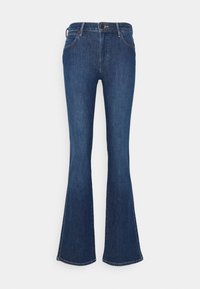 Jean en denim bleu foncé avec jambes évasées, fermeture avant par bouton et fermeture éclair, et poches avant, présenté sur un fond clair uni.