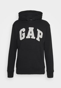 Black hooded sweatshirt made of cotton, featuring "GAP" in grey printed letters across the chest, with kangaroo pocket and ribbed cuffs.