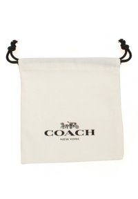 Sac en coton blanc avec cordon de serrage, portant un logo imprimé noir "COACH NEW YORK" et une petite illustration d'une voiture.