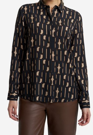 Langärmliges Hemd mit Knopfverschluss in Schwarz und Beige mit geometrischem Muster. Hergestellt aus weichem Stoff, mit spitzem Kragen und geradem Saum.