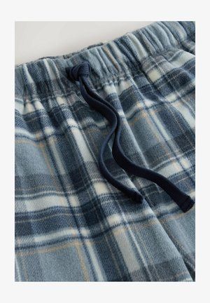 Fleece-pyjamasortsit sinivalkoisella ruutukuviolla, jossa on naruvyötärö ja pehmeä, teksturoitu kangas.