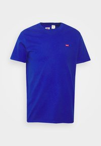 Blue cotton T-shirt with short sleeves, round neckline, and a small red logo on the chest. Simple design with a smooth texture.