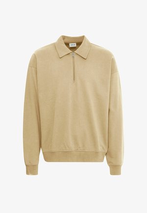 Pull beige avec un col zippé, des poignets côtelés et une coupe décontractée. Fabriqué en tissu doux avec une texture lisse. Design simple, sans motifs.