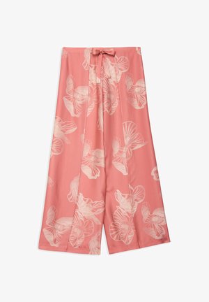 Pantalon rose à jambes larges avec de grands imprimés floraux clairs et une ceinture à nouer en tissu à la taille.