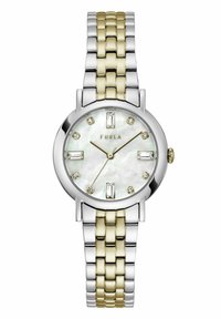Reloj redondo con banda de metal en tonos plata y dorado. Esfera de madreperla con marcadores de cristal y acentos dorados. Nombre de la marca "FURLA" visible.