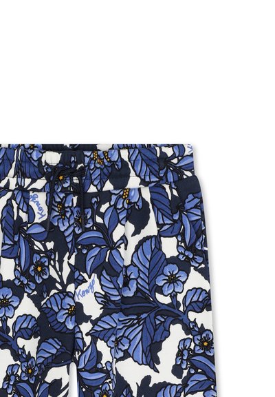 Pantalons de pyjama floraux avec un motif bleu marine et blanc ornés de fleurs bleues, taille élastique et cordon de serrage.