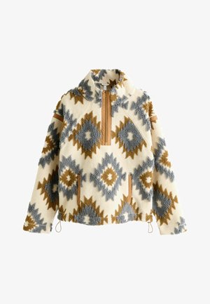 Fleece-Pullover mit elfenbeinfarbenem Hintergrund, mit blauen und braunen Rautenmuster. Halbreißverschluss vorne und seitliche Taschen mit braunen Details.