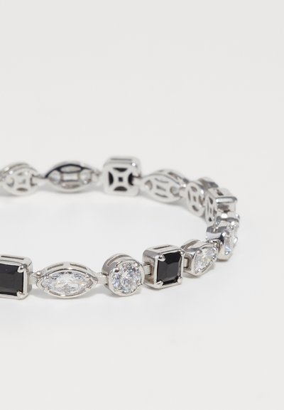 Silver-tone bracelet featuring alternating round, oval, and square black and clear stones, with intricate metal accents between each stone.