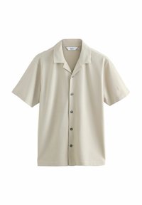 Chemise à manches courtes avec boutons en beige clair, dotée d'une texture douce, d'un col et de boutons frontaux de couleur contrastante.