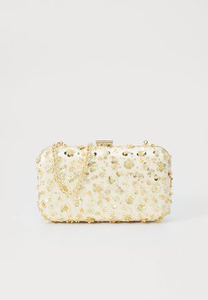Borsa a tracolla di forma rettangolare, realizzata in materiale bianco texturizzato, decorata con paillettes floreali dorate e una tracolla dorata.
