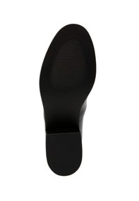 Scarpa nera con tacco alto, con un esterno liscio e una suola in gomma texturizzata. Il tacco è a forma di blocco, offrendo stabilità e aderenza.