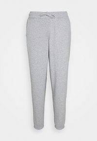 Pantalones de chándal gris ajustados con cinturilla elástica, cierre de cordón y puños elásticos. Fabricados en un tejido suave y texturizado. Sin bolsillos.
