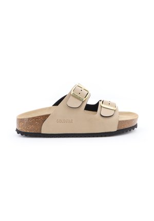Sandalo beige con suola in sughero, due fibbie regolabili dorate e marchio "Goldstar" sul lato, mostrato di profilo su sfondo bianco.