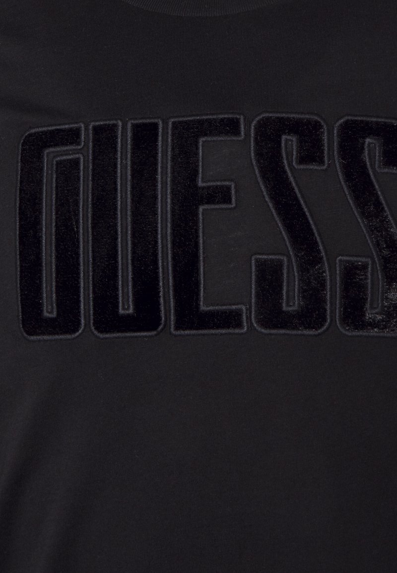 Herren T-Shirts basic | Guess BOLD FONT T-Shirt print jet black/schwarz - DB94651 Herren T-Shirts basic | Guess BOLD FONT T-Shirt print jet black/schwarz - DB94651
