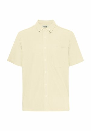 Camicia a maniche corte in tessuto giallo chiaro testurizzato. Presenta un colletto button-down, tasca frontale e patta di bottoni sul davanti.