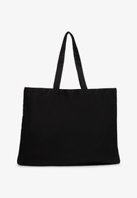 Czarna prostokątna torba materiałowa z dwiema długimi uchwytami na białym tle.