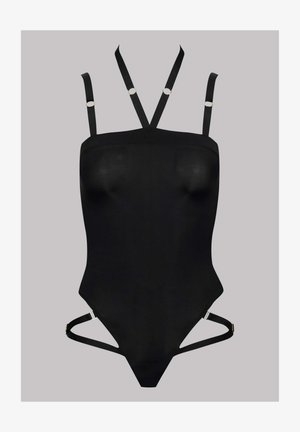 Bodysuit noir au design près du corps. Doté de bretelles ajustables avec des anneaux dorés et de découpes sur les côtés. Matériau lisse et extensible.