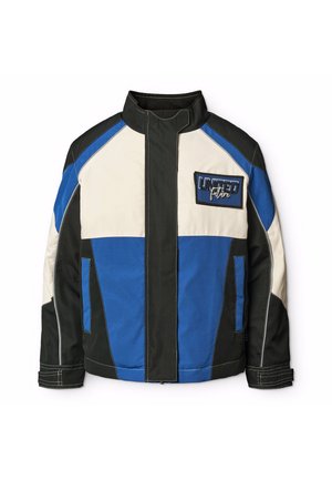 Herrenjacke mit einem Farbschema aus Schwarz, Blau und Creme. Merkmale einen hohen Kragen, einen Reißverschluss und einen Brustpatch mit dem Text "UNITED future".