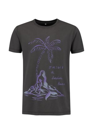 Black cotton t-shirt featuring a purple graphic of a palm tree and a figure on a rock, with the text "SHIWI the Sunshine Brand."