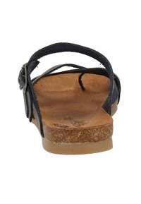 Marine sandal med tynde stropper og en korkfodbed. Har justerbar spænde og en flad gummisål. Glat tekstur og minimal detaljer.