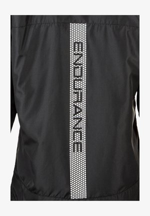Black windbreaker jacket featuring a reflective white text "ENDURANCE" along a vertical honeycomb-patterned stripe on the back. Lightweight material.