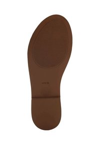 Brown rubber shoe sole with a smooth surface and vertical grooves for grip; features a raised lip at the heel and brand logo imprint.