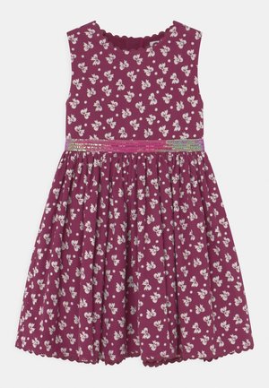 Fioletowa sukienka dziewczęca bez rękawów z białym kwiatowym wzorem, marszczoną spódnicą, falistymi brzegami i tęczową cekinową talią.