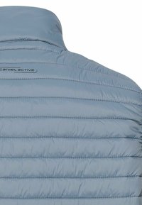 Light blue padded jacket with horizontal stitching, featuring a high collar and a subtle brand logo on the back. Smooth, lightweight material.
