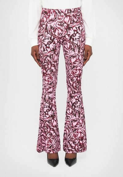 Flared trousers in pink and burgundy floral pattern, featuring a high waist and slim fit through the thigh, finished with a textured fabric.