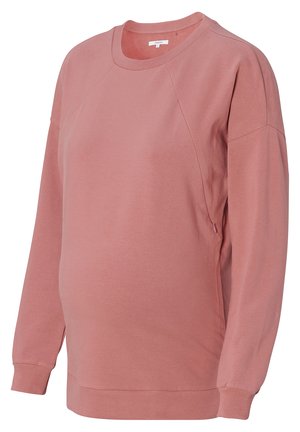Graviditets sweatshirt i blød, lyserød bomuldsblanding. Har en rund halsudskæring, raglanærmer og ribbede manchetter. Let løs pasform for komfort.