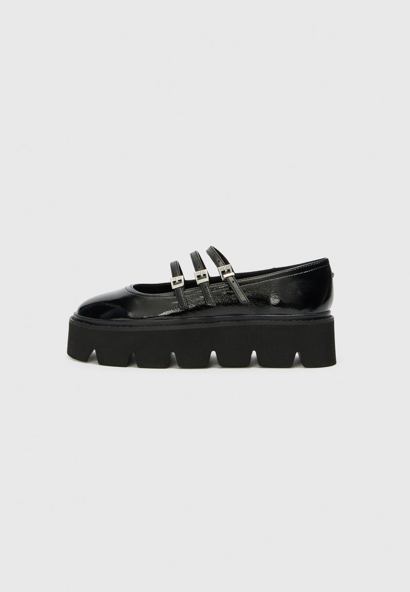 Black patent leather shoe with a thick black platform sole and three narrow straps across the vamp. Smooth texture, rounded toe design.